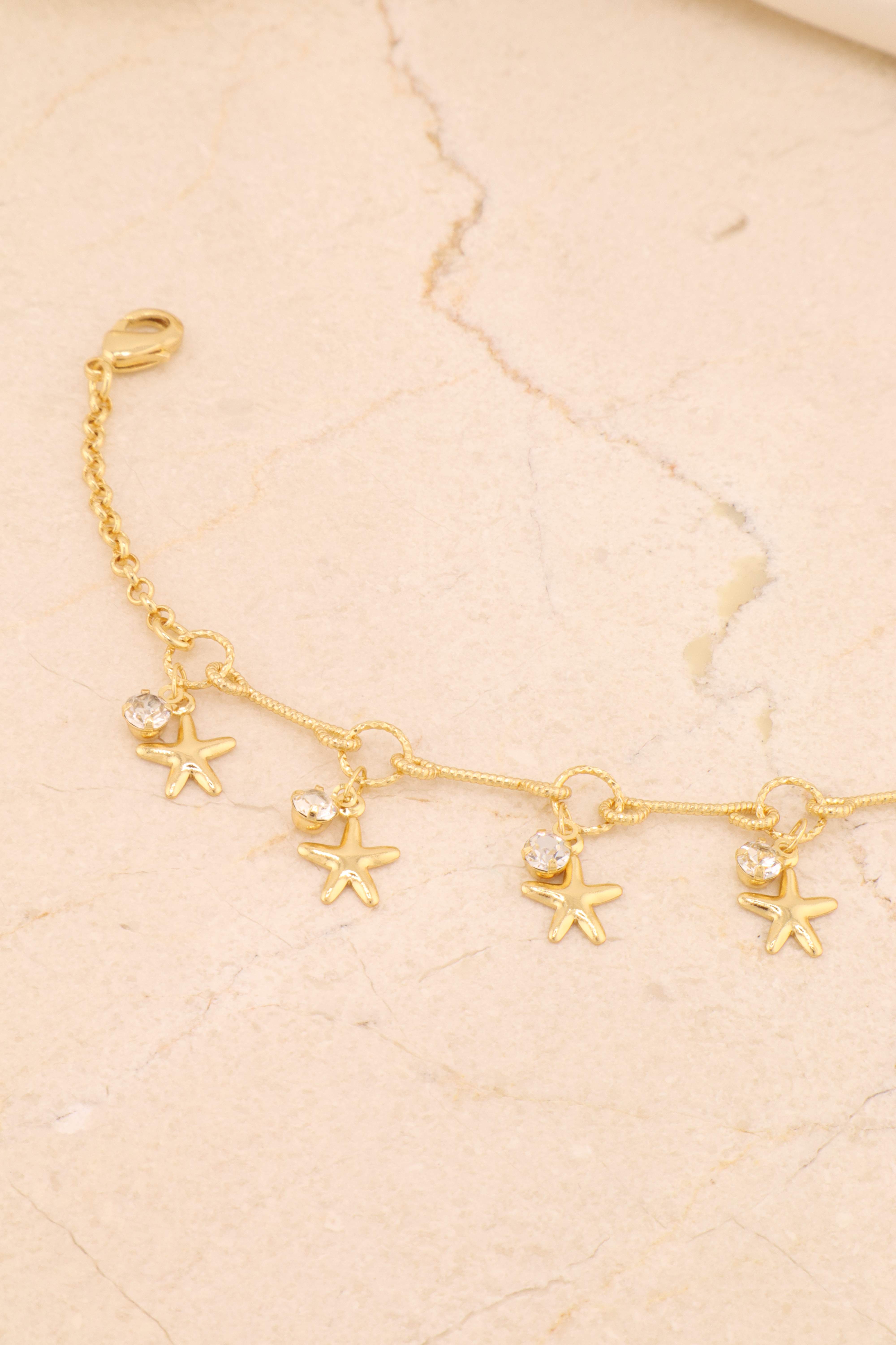 PULSEIRA PALITOS E AROS COM ESTRELAS E PONTO DE LUZ